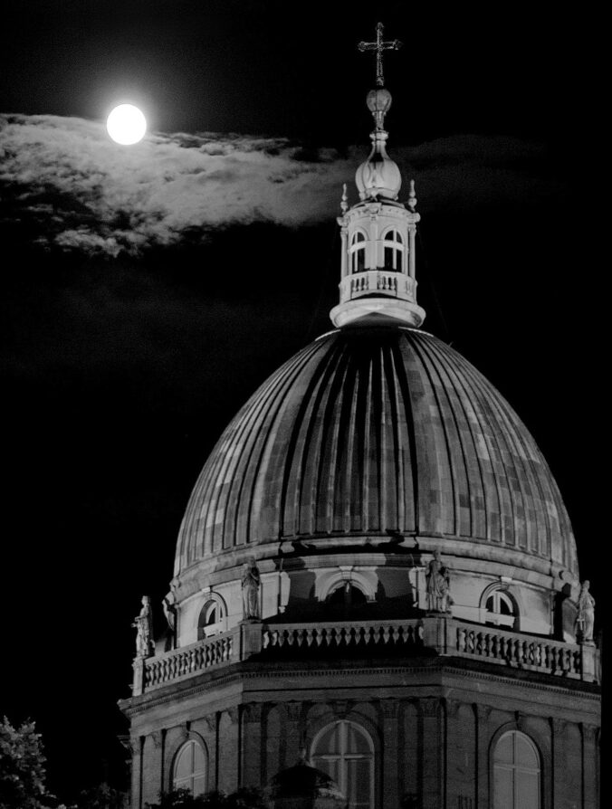 Black and white image of cathedral dome illuminated by full moon, Rio de Janeiro.